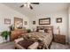 Charming bedroom with warm earth tones, furniture, and ample natural light from the windows at 4808 Straight Flush Dr # 103, Las Vegas, NV 89122