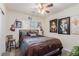 Bedroom decorated with celebrity portraiture, a decorative bedspread, and fan at 4808 Straight Flush Dr # 103, Las Vegas, NV 89122