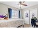Cozy bedroom featuring carpet flooring, a large window, and a closet at 5224 Red Vine St, North Las Vegas, NV 89031