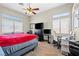 Bright bedroom with ample natural light, carpeted flooring, and functional work space at 5224 Red Vine St, North Las Vegas, NV 89031
