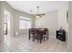 Bright dining room features tile floors and a modern ceiling fan fixture at 5224 Red Vine St, North Las Vegas, NV 89031