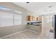 Well-lit kitchen area with tile flooring, granite countertops and stainless steel appliances at 5224 Red Vine St, North Las Vegas, NV 89031