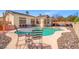 Enjoy outdoor dining with a pool view in this backyard, complete with a refreshing pool and ample seating space at 5224 Red Vine St, North Las Vegas, NV 89031