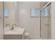 Bright bathroom with a glass shower, sleek vanity, and neutral finishes at 5409 Holmby Ave, Las Vegas, NV 89146