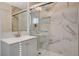 Bathroom featuring a stylish vanity and tiled walk-in shower at 5409 Holmby Ave, Las Vegas, NV 89146