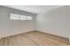 Bright bedroom with light wood flooring and a window at 5409 Holmby Ave, Las Vegas, NV 89146