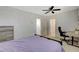 Bedroom view with a desk, ceiling fan, and light-filled doorway at 5409 Holmby Ave, Las Vegas, NV 89146