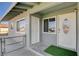 Welcoming front entrance featuring dual doors, a security gate, and a cozy entryway at 5409 Holmby Ave, Las Vegas, NV 89146