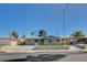 Charming single-story home with a well-manicured lawn and secure chain-link fence at 5409 Holmby Ave, Las Vegas, NV 89146