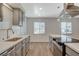 Bright kitchen with gray cabinets, stainless steel appliances, and plenty of natural light at 5409 Holmby Ave, Las Vegas, NV 89146