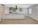 Modern kitchen with stainless steel appliances and a functional breakfast bar at 5409 Holmby Ave, Las Vegas, NV 89146