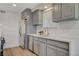 Updated kitchen with gray cabinets, stainless steel appliances, and a bright, clean design at 5409 Holmby Ave, Las Vegas, NV 89146