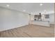 Spacious open-concept living space with modern flooring and recessed lighting at 5409 Holmby Ave, Las Vegas, NV 89146