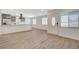 Bright, open-concept living area featuring stylish floors and a modern kitchen at 5409 Holmby Ave, Las Vegas, NV 89146