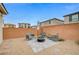 Backyard with gravel, patio, and a brick privacy wall at 5479 Tamar Ridge Ct, Las Vegas, NV 89141