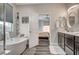 Elegant bathroom featuring a soaking tub, double vanity, and modern fixtures at 5479 Tamar Ridge Ct, Las Vegas, NV 89141
