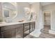 Modern bathroom featuring double sinks, sleek cabinets, and ample counter space at 5479 Tamar Ridge Ct, Las Vegas, NV 89141