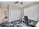 Home office with ceiling fan, pull down bed, and a closet with sliding doors at 5479 Tamar Ridge Ct, Las Vegas, NV 89141
