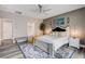 Beautiful main bedroom featuring a ceiling fan, bed, and a stylish area rug at 5479 Tamar Ridge Ct, Las Vegas, NV 89141