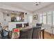 Bright dining area with hardwood floors, plantation shutters, and access to the kitchen at 6160 Majestic Wind Ave, Las Vegas, NV 89122