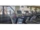 Well-equipped exercise room with treadmills, weight machines, and scenic views of the pool at 6160 Majestic Wind Ave, Las Vegas, NV 89122