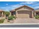 Charming single-story home featuring a well-manicured front yard and a two-car garage with a paved driveway at 6160 Majestic Wind Ave, Las Vegas, NV 89122