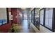 Brightly lit hallway with elegant tiled floors, potted plants, and decorative wall accents at 6160 Majestic Wind Ave, Las Vegas, NV 89122