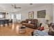 Comfortable living room with hardwood floors, ceiling fan, and ample natural light at 6160 Majestic Wind Ave, Las Vegas, NV 89122