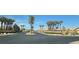 Street view of the Solera community showcases palm trees and manicured landscaping at 6160 Majestic Wind Ave, Las Vegas, NV 89122