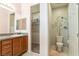 Bathroom featuring a single sink vanity, a toilet and a closet with organizers at 6317 Highledge St, North Las Vegas, NV 89081