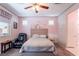 Charming bedroom with cozy decor, natural light, and an ensuite bathroom, creating a private retreat at 6317 Highledge St, North Las Vegas, NV 89081
