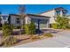 Charming single-Gathering home with a two-car garage and well-manicured landscaping at 6317 Highledge St, North Las Vegas, NV 89081