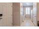 Bright laundry room with appliances, a window, and ample storage space at 6317 Highledge St, North Las Vegas, NV 89081