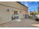 Private backyard features low maintenance gravel landscaping, exterior lighting, and block wall fencing at 644 Chase Tree St, Las Vegas, NV 89144