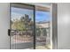 View from the balcony showcasing the neighborhood with trees, rooftops, and mountains at 644 Chase Tree St, Las Vegas, NV 89144