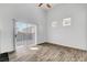 Bright bedroom featuring wood-look flooring and a sliding glass door at 644 Chase Tree St, Las Vegas, NV 89144