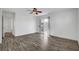 Well-lit bedroom with a balcony, a ceiling fan, and light-colored flooring throughout at 644 Chase Tree St, Las Vegas, NV 89144