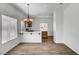 Open kitchen features an island with bar seating and modern lighting at 644 Chase Tree St, Las Vegas, NV 89144