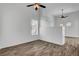 Bright, open living room featuring vaulted ceilings and wood-look flooring at 644 Chase Tree St, Las Vegas, NV 89144