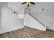 Open-concept living area with wood-look flooring and staircase at 644 Chase Tree St, Las Vegas, NV 89144