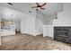Spacious living room showcasing the fireplace and open layout to the kitchen at 644 Chase Tree St, Las Vegas, NV 89144