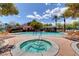 Community pool and spa area with lounge chairs and shade at 644 Chase Tree St, Las Vegas, NV 89144