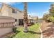 This serene backyard features a pergola with seating and low maintenance landscape at 6440 High Sierra Ave, Las Vegas, NV 89156