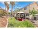 This backyard features an outdoor gazebo with seating area and lush landscaping at 6440 High Sierra Ave, Las Vegas, NV 89156