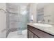 This modern bathroom features a glass shower and stylish vanity with countertop at 6440 High Sierra Ave, Las Vegas, NV 89156