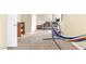 Large bonus room with neutral carpeting, a hammock, and exercise equipment, offering flexible space at 6440 High Sierra Ave, Las Vegas, NV 89156