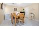 Dining room features a wooden dining table and a small, white mini freezer at 6440 High Sierra Ave, Las Vegas, NV 89156