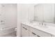 Modern bathroom features dual sinks, chrome fixtures, and sleek white cabinets at 647 Spotted Falcon St, Las Vegas, NV 89138