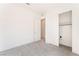 Carpeted bedroom with bright white trim and closet with sliding door at 647 Spotted Falcon St, Las Vegas, NV 89138