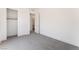Carpeted bedroom boasts bright white trim and a closet for storage at 647 Spotted Falcon St, Las Vegas, NV 89138